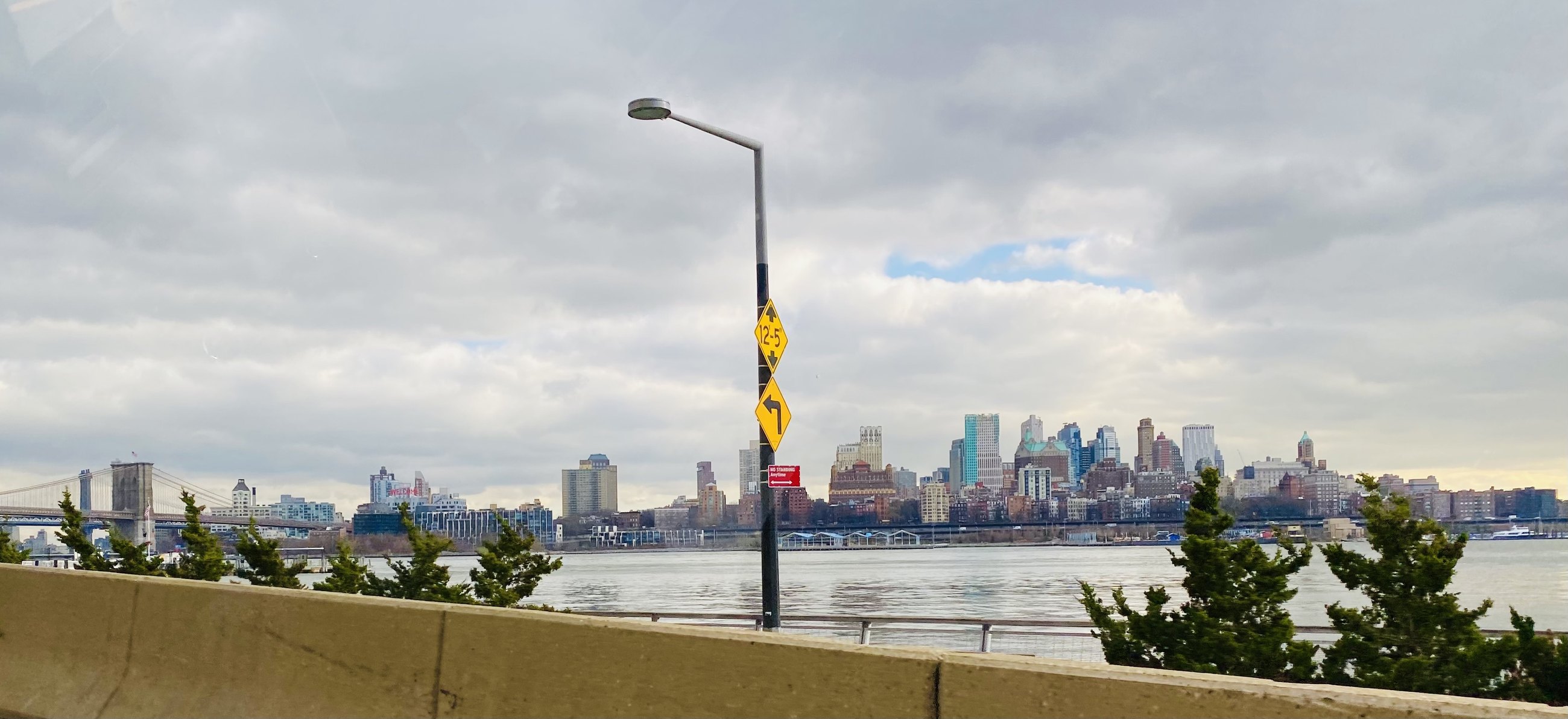 Manhattan across the water, seen from a roadside