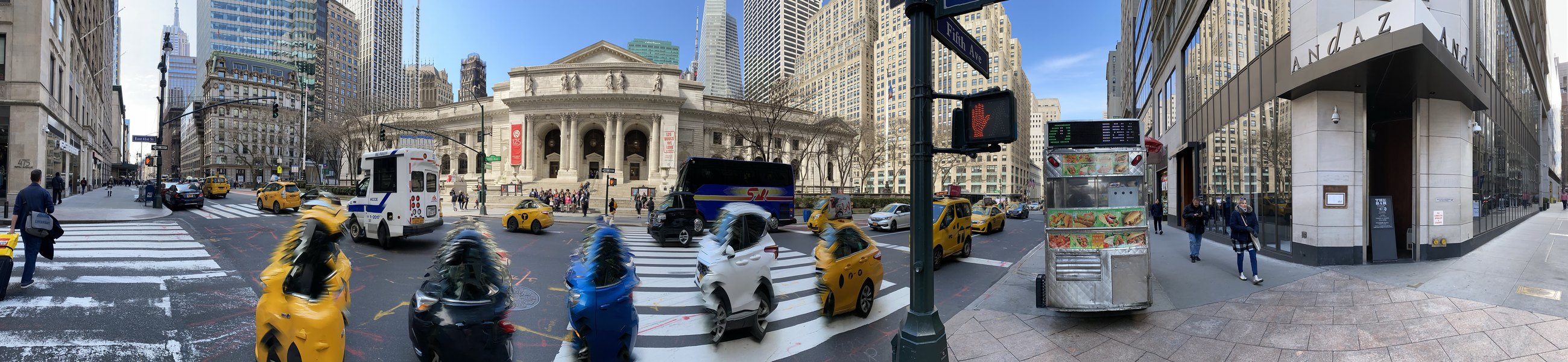 The New York Public Library and the taxis on Fifth