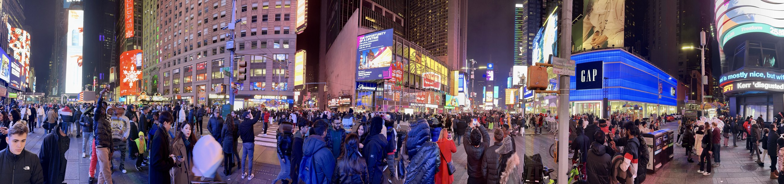 Times Square at night, shoulder to shoulder
